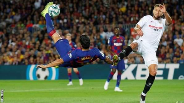 La Liga: Suarez & Messi Star in Sevilla Thrashing.